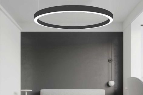 Creative lighting solutions can be achieved in large areas by staggering different-sized Orbit pendants at varying heights.