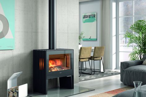 The Glance L freestanding fireplace creates a strong focal point in any room with a large glass-sided landscape firebox.